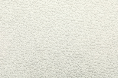 Photo of Texture of light leather as background, closeup