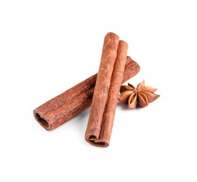 Photo of Cinnamon sticks and anise star isolated on white