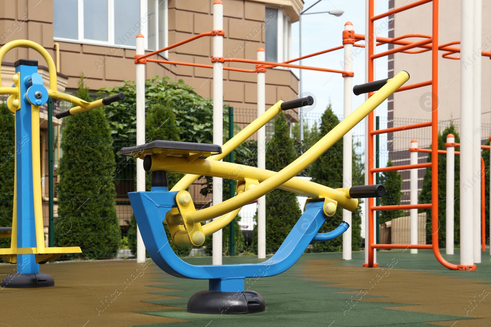 Photo of Empty outdoor playground with exercise equipment in residential area