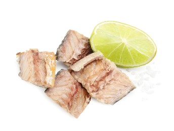 Photo of Delicious canned mackerel chunks with salt and lime on white background, top view