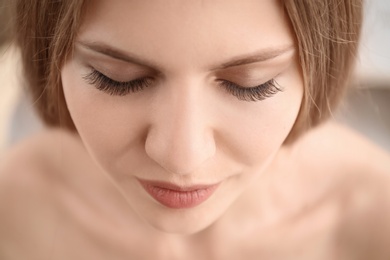 Attractive young woman with beautiful eyelashes, closeup