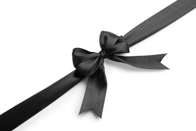 Photo of Black satin ribbon with bow isolated on white, top view