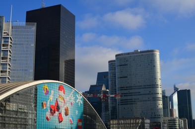 Paris, France - December 10, 2022: Beautiful cityscape with Lego Christmas advertising on building exterior