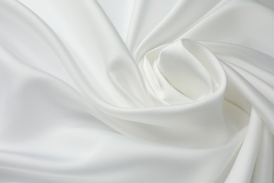 Photo of Texture of crumpled white silk fabric as background, closeup