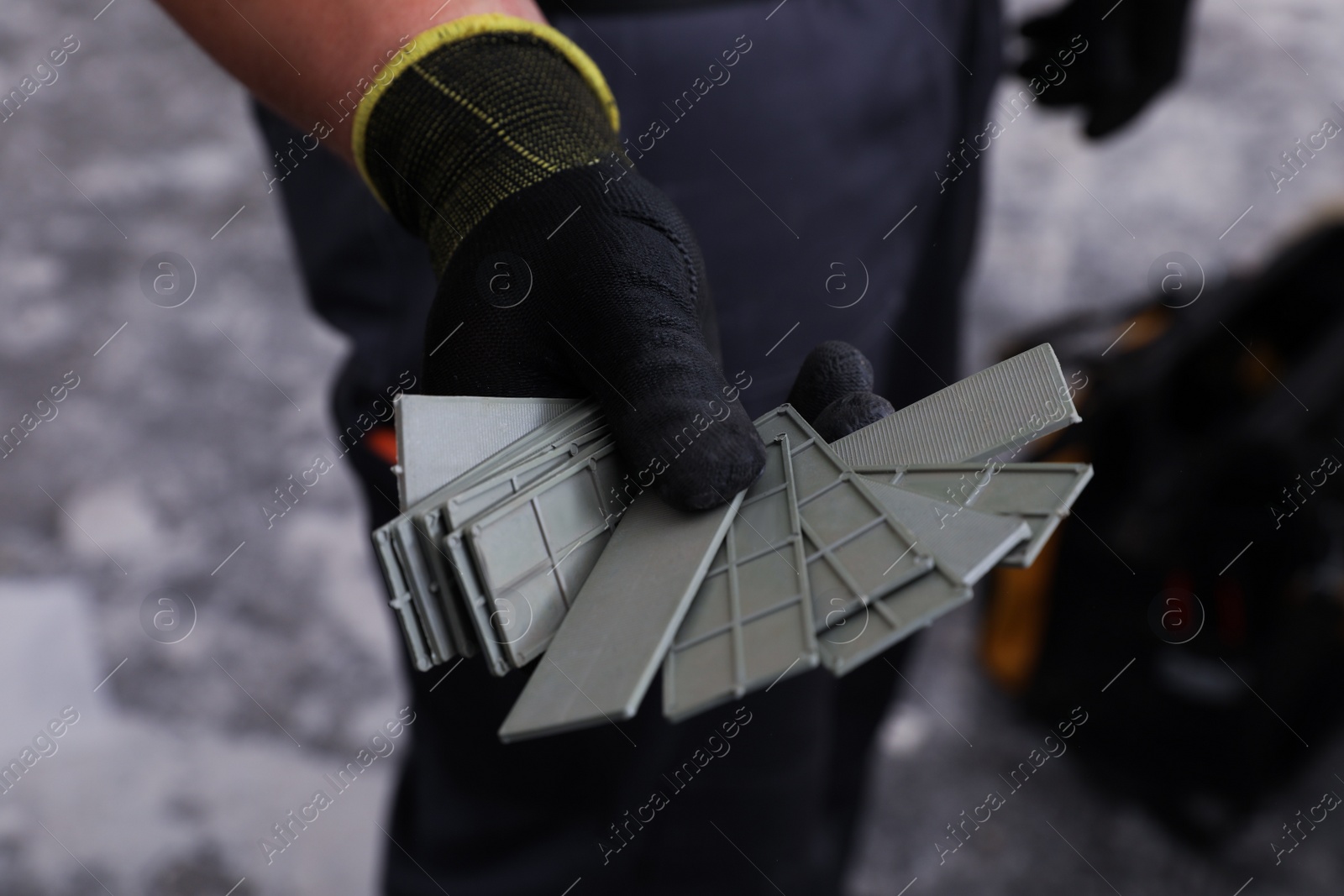 Photo of Worker holding details for window installation, closeup