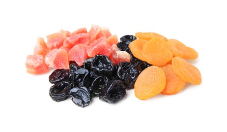 Pile of different tasty dried fruits on white background