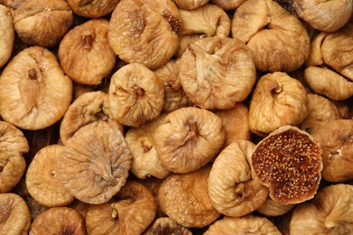 Many tasty dried figs as background, top view