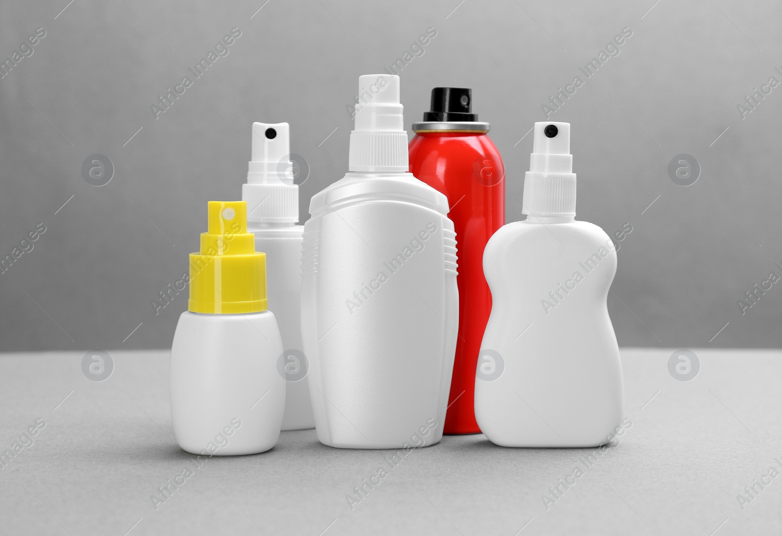 Photo of Set of different insect repellents on grey background