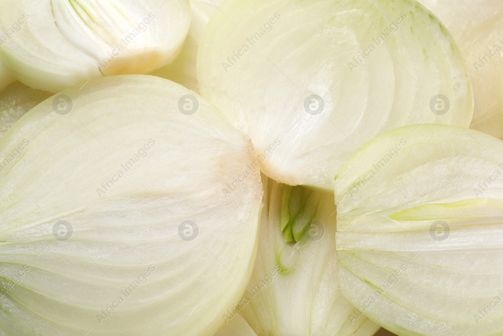 Photo of Pieces of fresh ripe onion as background