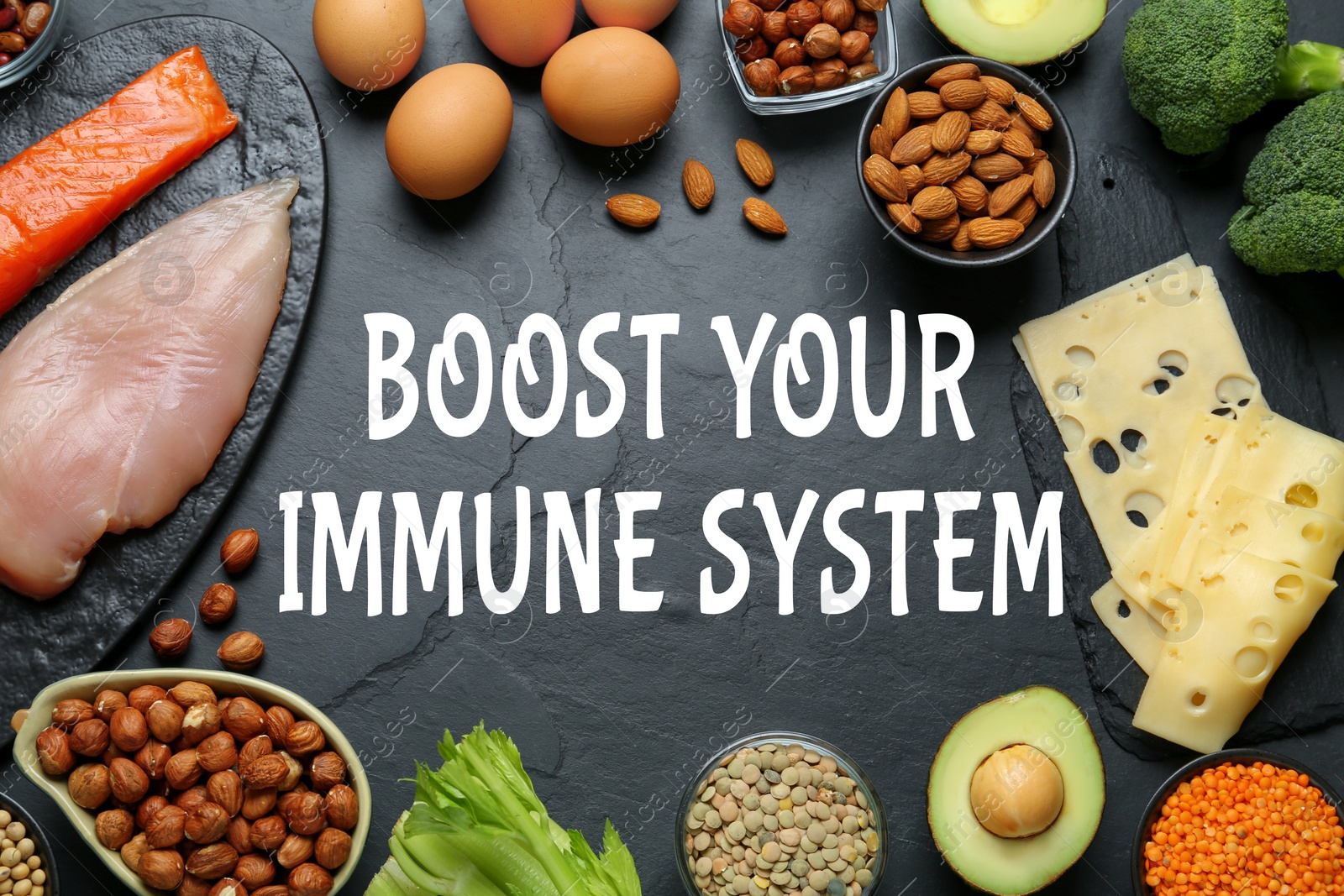 Image of Boost your immune system with proper diet. Different foods on black table, flat lay
