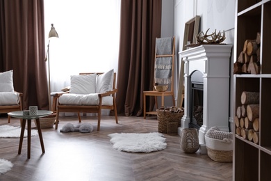 Beautiful living room interior with fireplace and armchairs