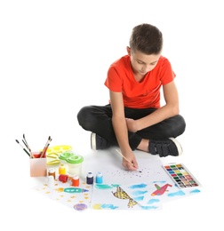 Cute child painting picture on white background