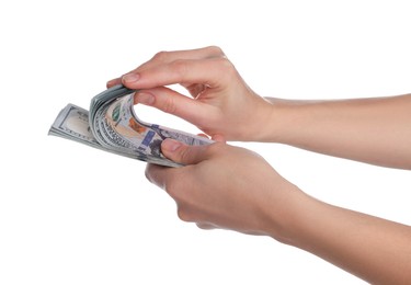 Money exchange. Woman holding dollar banknotes on white background, closeup