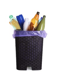Photo of Trash bin full of plastic bottles on white background. Recycling rubbish