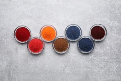 Many different food coloring on light grey table, flat lay