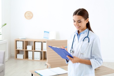 Photo of Female medical assistant working in clinic. Health care service