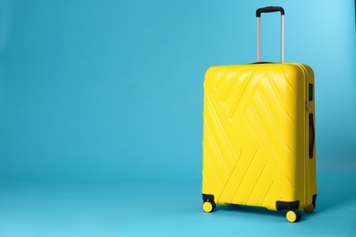 Photo of Stylish suitcase on color background. Space for text