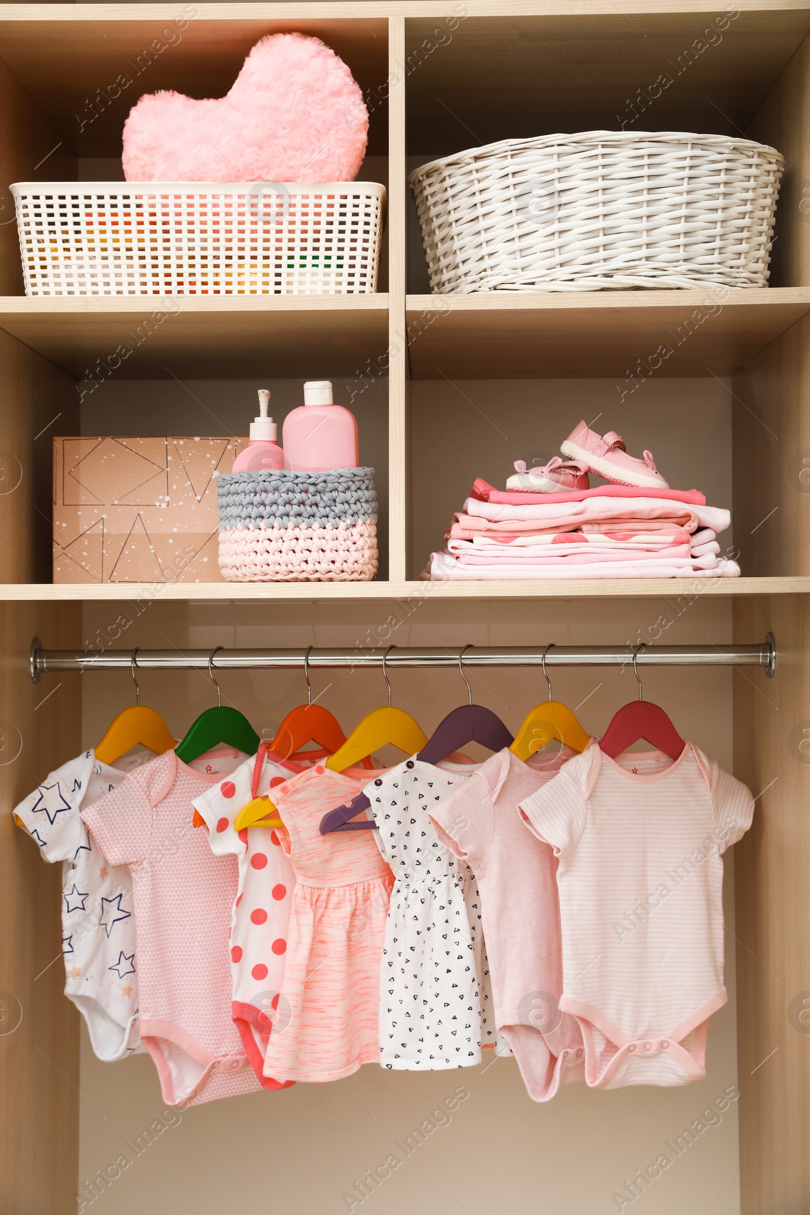 Photo of Wardrobe with cute baby clothes and home stuff