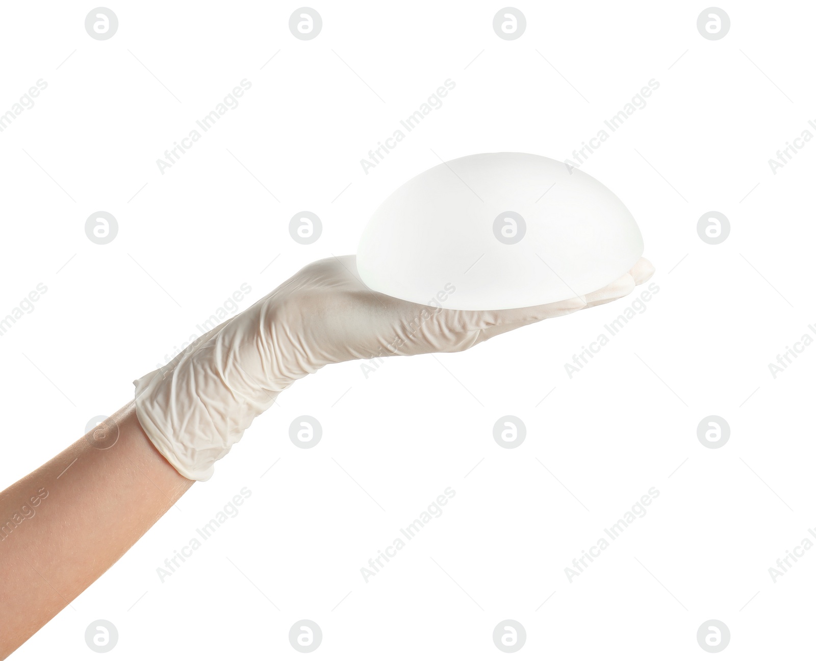 Photo of Doctor holding silicone implant for breast augmentation on white background. Cosmetic surgery