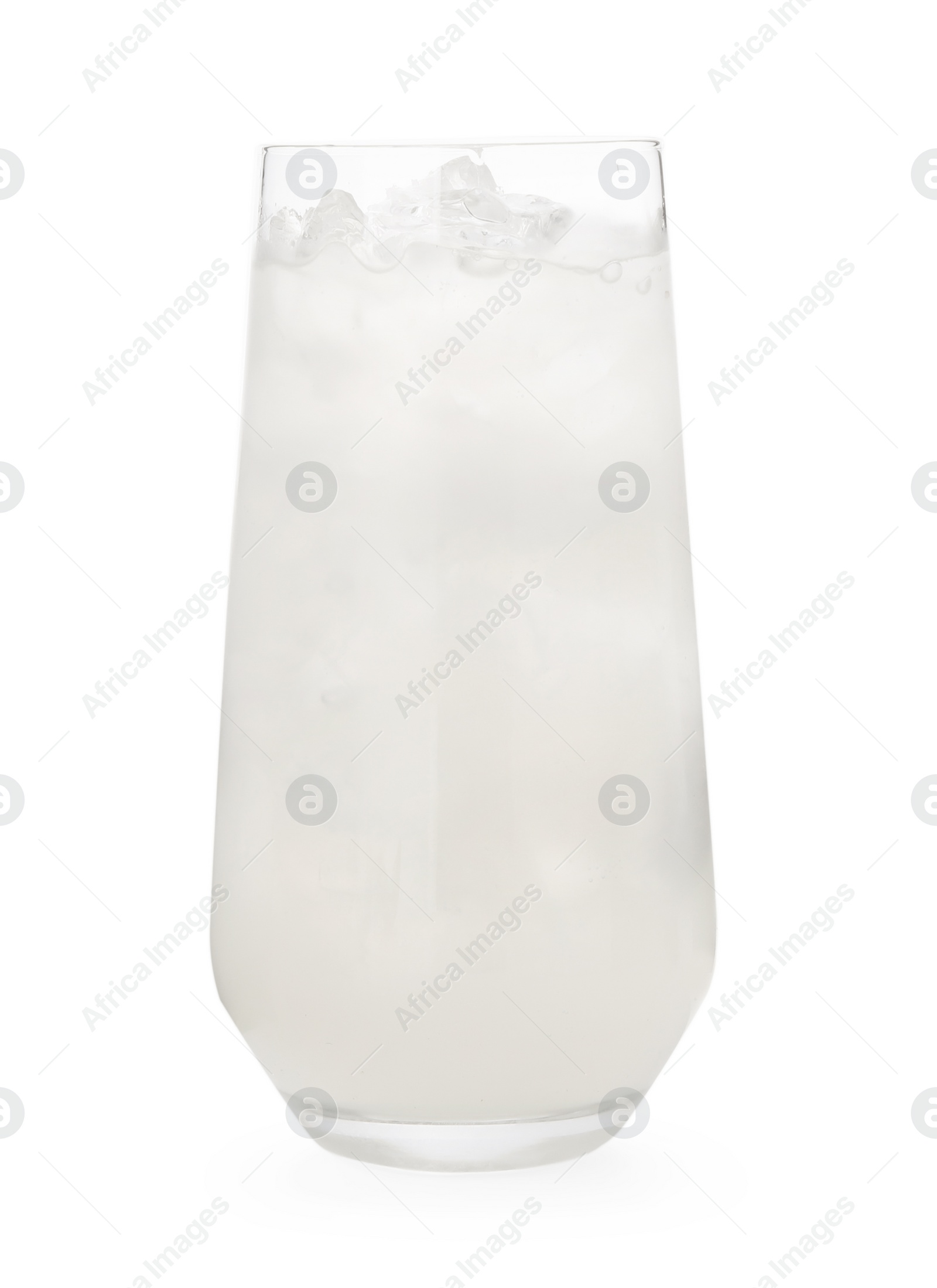 Photo of Glass of coconut water with ice cubes isolated on white