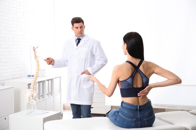 Young woman visiting orthopedist in medical office