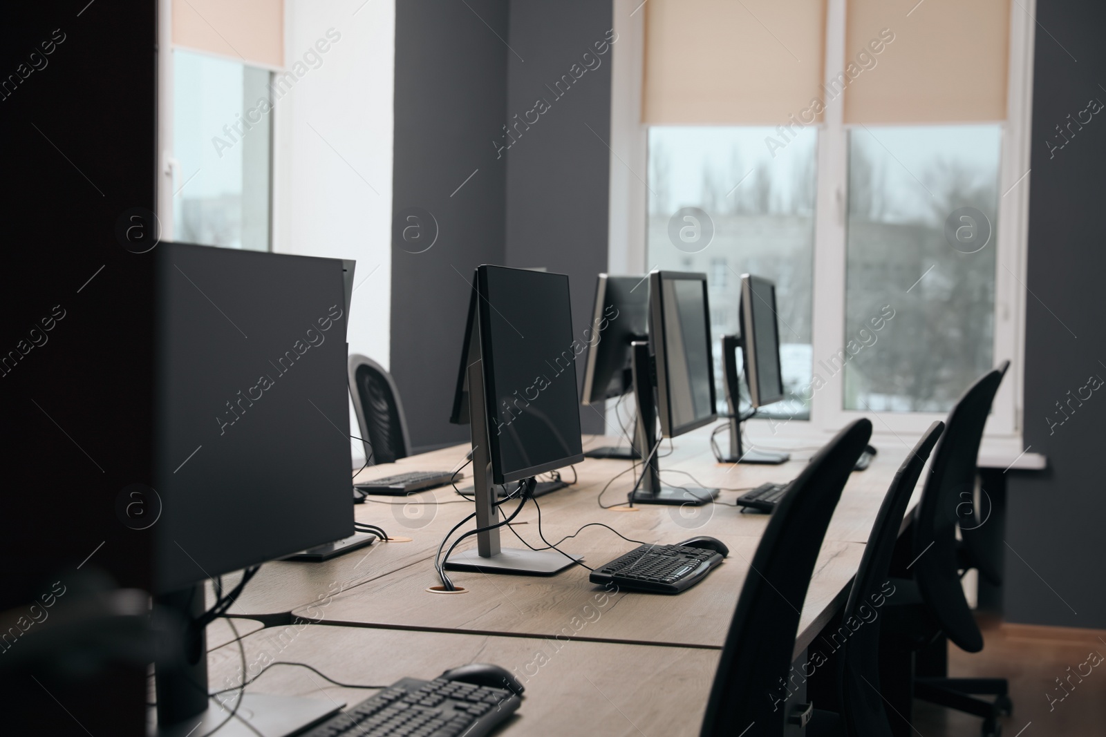 Photo of Many modern computers in open space office