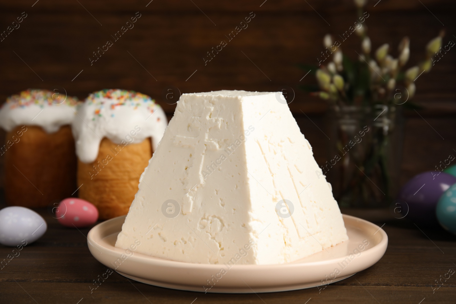 Photo of Traditional cottage cheese Easter paskha on wooden table