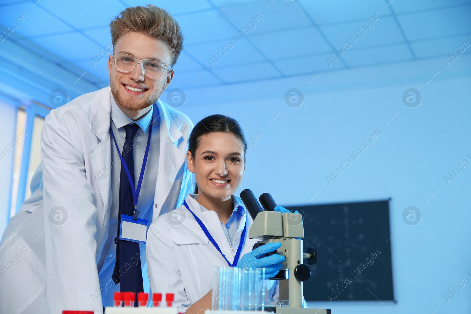 Photo of Portrait of scientists in chemistry laboratory, space for text