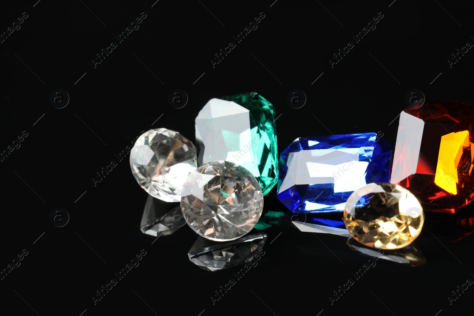 Photo of Beautiful gemstones for jewelry on black background