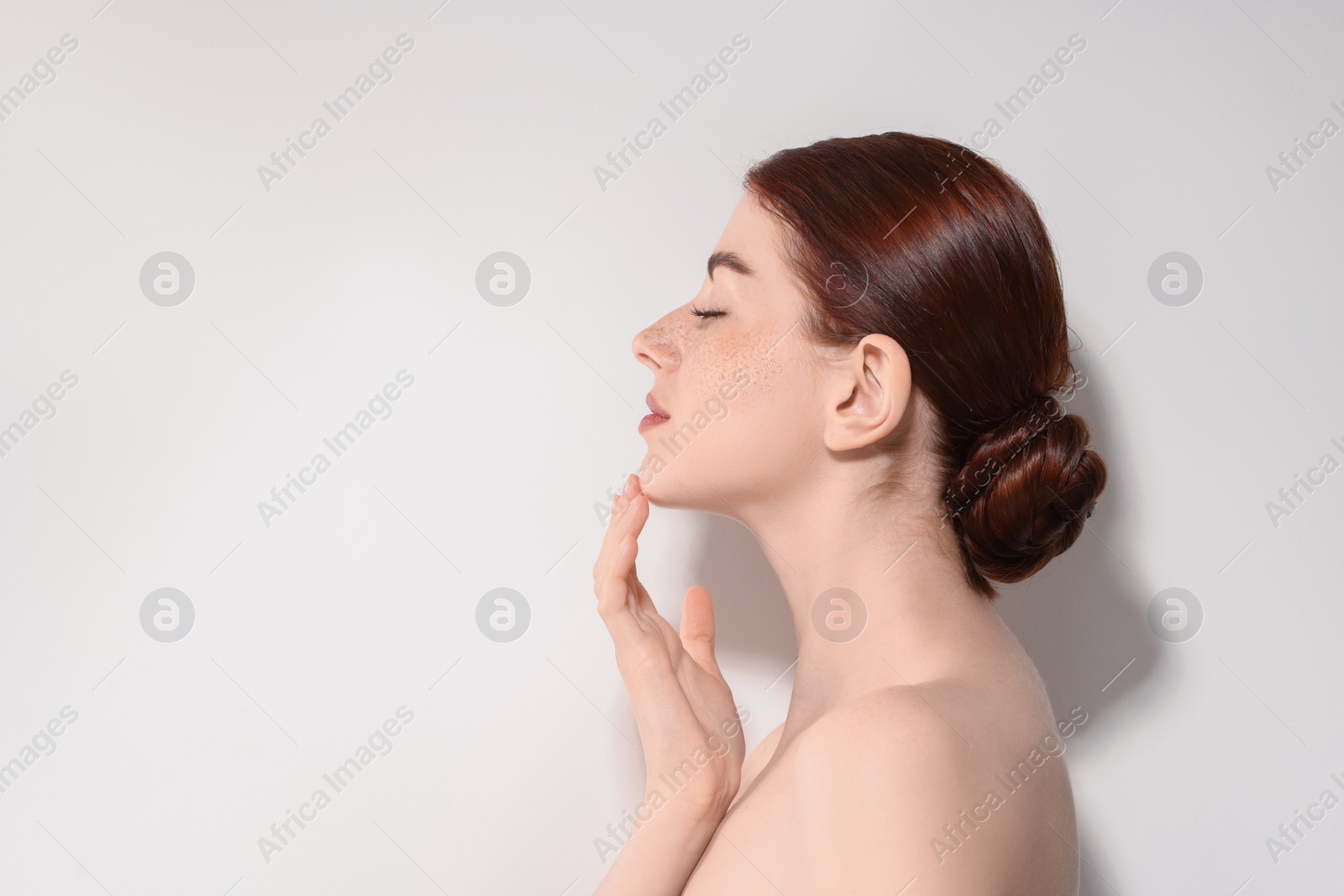 Photo of Portrait of beautiful woman on light background. Space for text