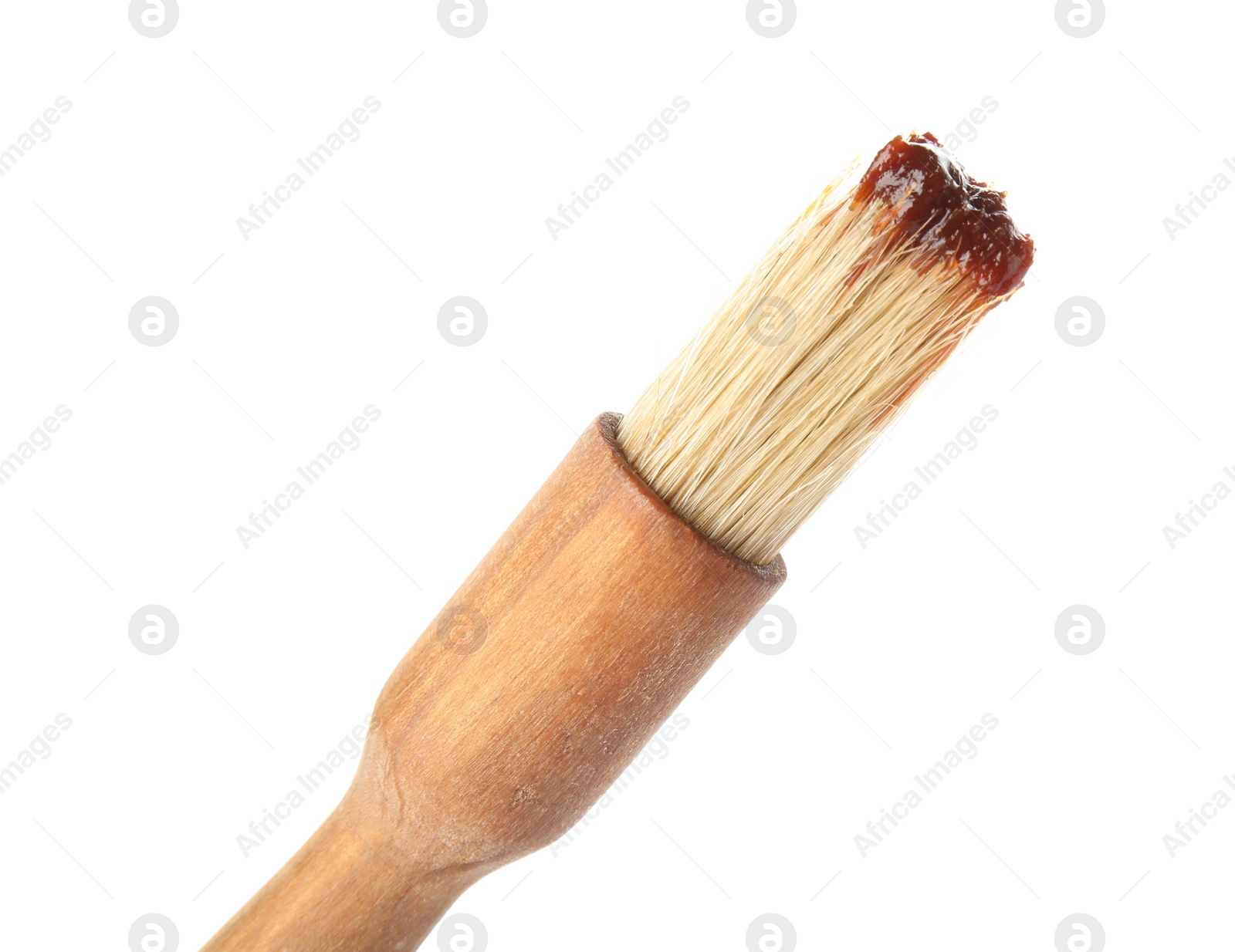 Photo of Basting brush with barbecue sauce on white background