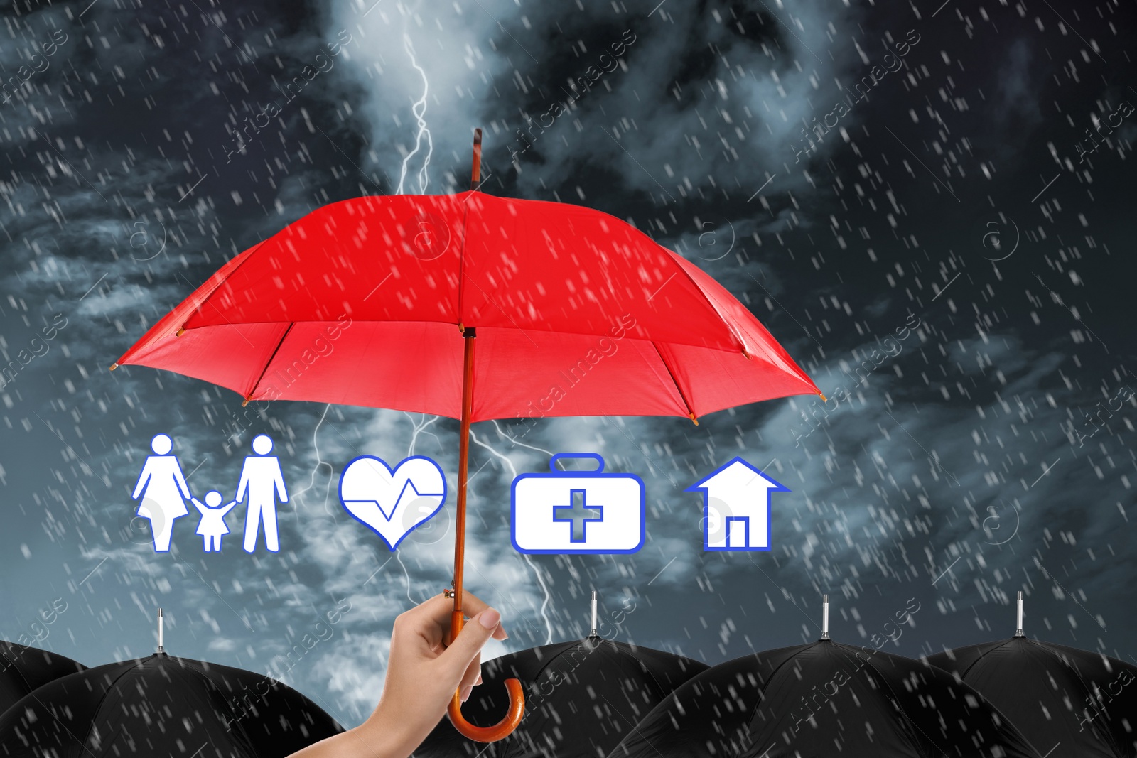 Image of Insurance agent covering illustrations with red umbrella during storm