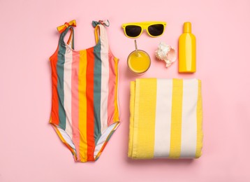 Photo of Flat lay composition with beach objects on pink background
