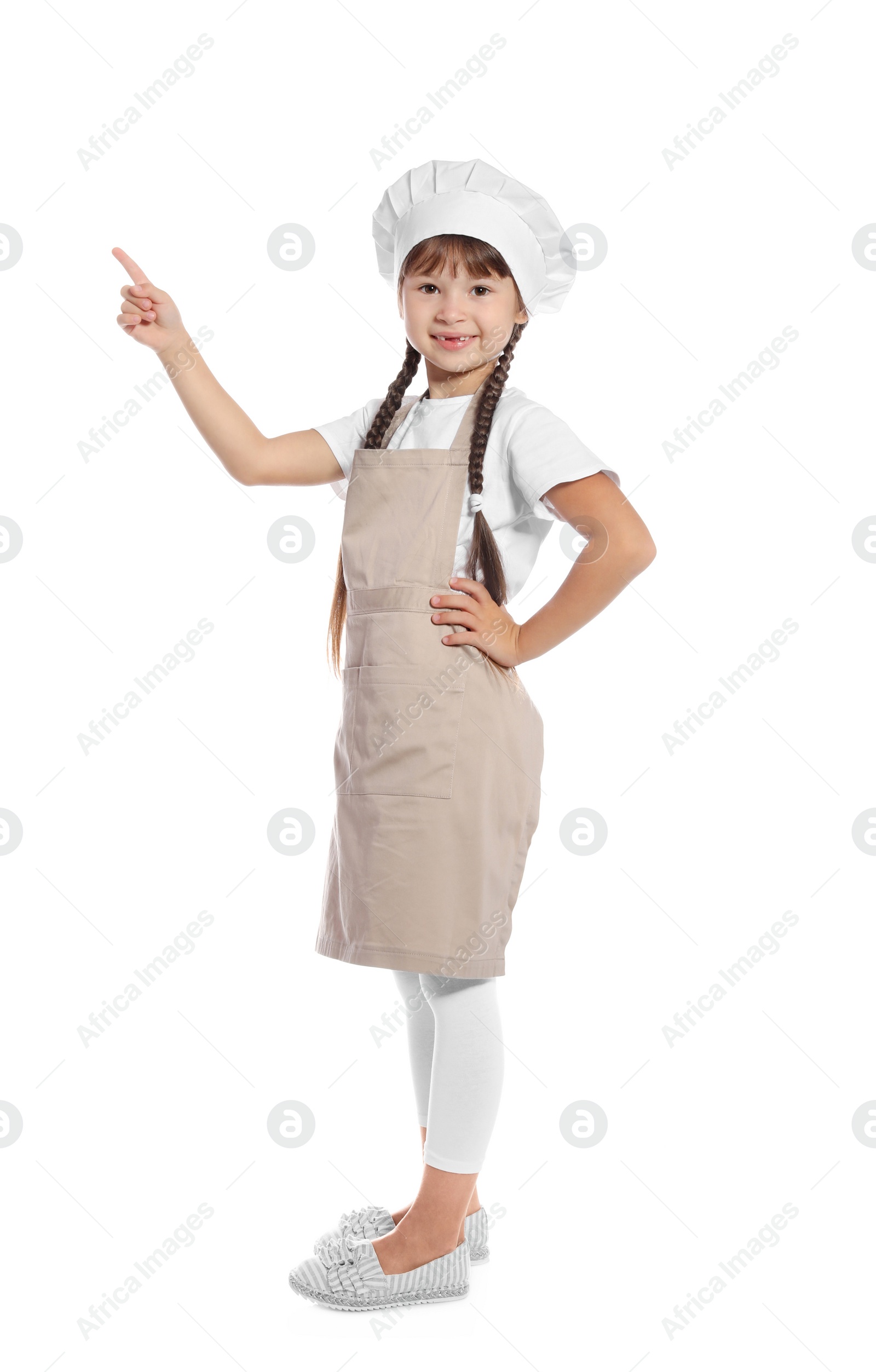 Photo of Full length portrait of little girl in chef hat on white background