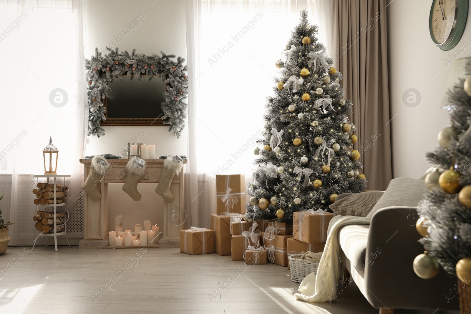 Photo of Stylish Christmas interior with beautiful decorated tree and fireplace