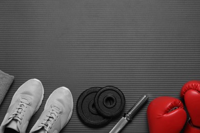 Photo of Flat lay composition with sports equipment on grey mat, space for text