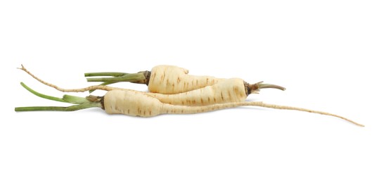 Photo of Tasty fresh ripe parsnips on white background