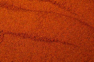 Aromatic paprika powder as background, top view