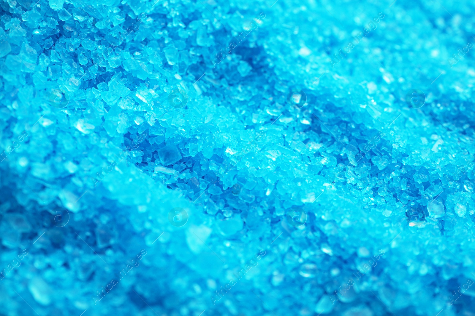 Photo of Blue aromatic sea salt as background, closeup