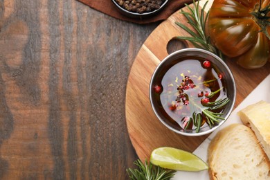 Tasty marinade and products on wooden table, top view. Space for text