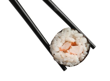 Photo of Chopsticks with tasty fresh sushi roll isolated on white