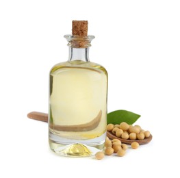 Photo of Glass bottle of oil, soybeans and leaf on white background