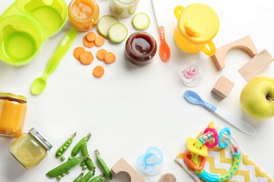 Flat lay composition with baby food, ingredients and accessories on light background