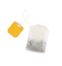 Photo of Paper tea bag with tag isolated on white, top view