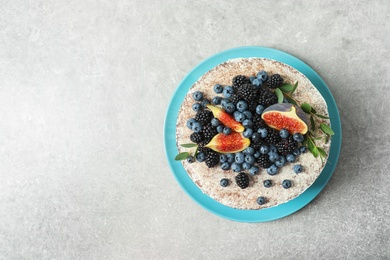 Delicious homemade cake with fresh berries and space for text on table, top view