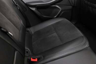 Leather seat inside of modern black car, closeup