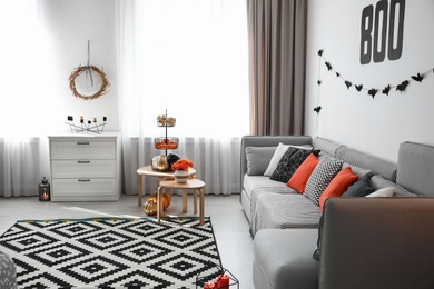Photo of Modern room decorated for Halloween. Festive interior