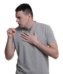 Photo of Young man coughing on white background. Cold symptoms