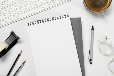 Photo of Flat lay composition with notebooks and coffee on white table