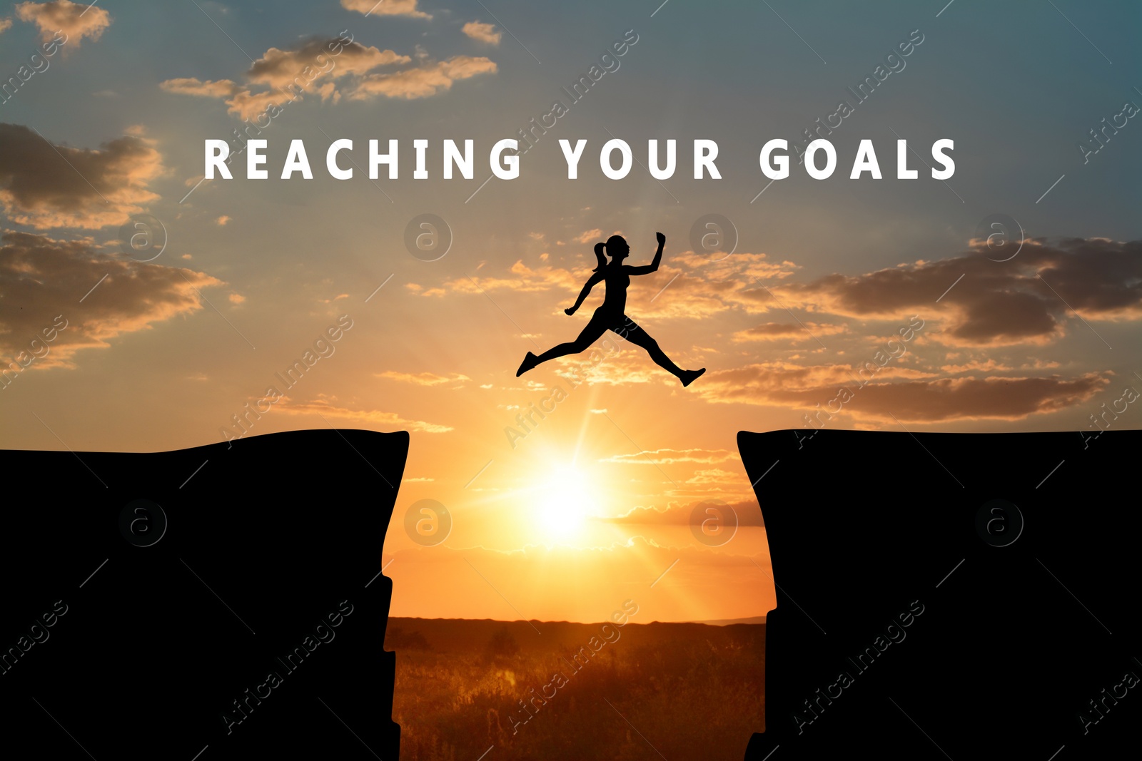 Image of Concept of reaching life and business goals. Silhouette of woman jumping over chasm at sunrise